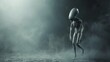 Scary gray alien walks and looks blinking on a dark smoky background. UFO futuristic concept, sci-fi character, copy space.
