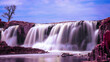 Falls Park and Big Sioux River in Sioux Falls, South Dakota, USA, water falling over quartzite and pipestone rock formations