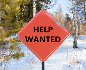 Wall Mural - Help wanted and support symbol. Concept words Help wanted on beautiful red road sign. Beautiful forest snow blue sky background. Business, support, help wanted concept. Copy space.