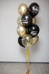 Wall Mural - black and gold balloons for men, inscriptions on the balloons: “wise master”, “True master”