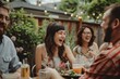 © Iftikhar alam - Family members gathered at a backyard barbecue, laughing while sitting around a table, A backyard barbecue with family members laughing and enjoying each other's company