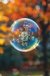 Close-up of soap bubble with reflections and sun flare