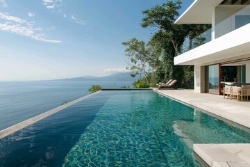 Sticker - A contemporary villas spacious swimming pool overlooks the vast ocean beyond, creating a stunning visual contrast, A contemporary villa with minimalist design and infinity pool