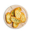 Garlic crisp bread Slices Topped With Herbs on cutting board isolated on white background.