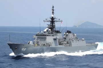 Modern warship sailing in still water. 