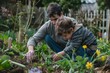 © Iftikhar alam - A man and a young boy are gardening in a lush garden, A father and son working together in the garden, planting flowers