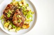 Allspice Pork Chops with Sautéed Leeks, Golden Apples, and Aromatic Allspice Butter