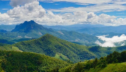 Wall Mural - amazing wild nature view of layer of mountain forest landscape with cloudy sky natural green scenery of cloud and mountain slopes background maehongson thailand panorama view