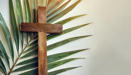 palm sunday holiday wooden cross with palm leaf on light background with copy space religion background suitable for faith religion christian holidays easter redeemer the feast of corpus christi