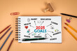 2025 Goals. Notepad and office supplies on a light background