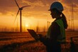 Silhouette of an engineer woman with a laptop standing near wind turbines at sunset sky background, a female power plant worker working on a project using technology and holding a tablet Generative AI