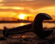 A dramatic image of a wrench silhouetted against a sunset, resting on a gritty construction site, symbolizing the end of a hard days work