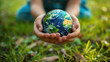 Person Holding Small Earth in Hands