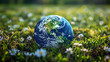 Earth Day Celebration With a Small Globe Resting in a Spring Meadow