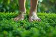 The soft, springy texture of fresh grass, tickling bare feet. Concept of outdoor recreation. Generative Ai.