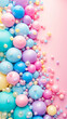 A colorful array of balloons in various shades of pink, blue, and yellow