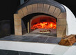 A large pizza Oven fired up for cooking pizza