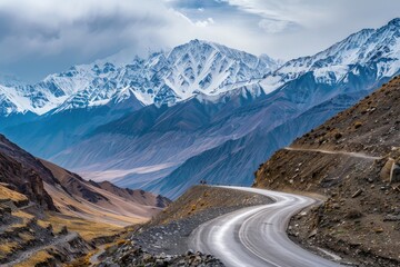 Wall Mural - Endless mountain roads winding through rugged peaks and vast valleys.