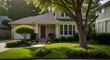 Clean exterior home with lush green grass yard, trees in bloom, and flowering bushes during spring time season.