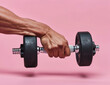 A man holding a heavy gym dumbbell barbell weight