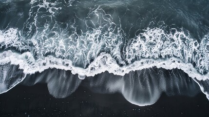 Wall Mural - Dramatic Aerial View of a Black Sand Beach and Waves