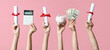 Female hands holding diplomas, money, calculator and piggy bank on pink background