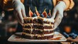   A tight shot of a person's hands holding a slice of cake on a plate The cake is adorned with luscious figs atop it