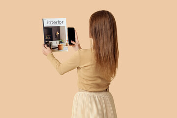 Wall Mural - Beautiful woman with magazine and mobile phone on beige background, back view