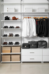Wall Mural - Rack with clothes and shoes in modern man's wardrobe