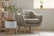 © Pixel-Shot - Interior of light living room with grey armchair and plants
