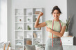© Pixel-Shot - Young African-American woman with tape measure showing muscles at home. Diet concept