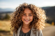 © ako-photography - Close up portrait of a beautiful young girl with curly hair in the park