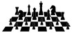 Set of chessboard pieces arranged on a chessboard pattern