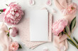 Greeting card mockup, empty pink card with peonies flowers on white background. top view flatlay. Card mockup with copy space. Mother's day, Birthday card	