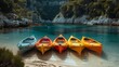 Kayaks boats on the sandy beach on the turquoise sea or ocean. Sea coast with kayaks, water sport