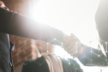 Businessmen greeting by a handshake