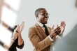 © Rawpixel.com - Diverse business people applauding with joy