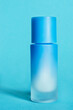Cosmetic bottle on blue background