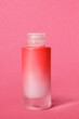 Cosmetic jar on pink background