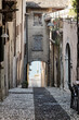 Charming cobblestone alley in italian old town