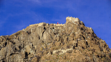 Wall Mural - 4 February 2024 Afyonkarahisar Turkey. Afyonkarahisar castle and Afyon cityscape from castle on a cloudy winter day