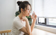 © Q88 - Portrait of beautiful young Asian girl at home