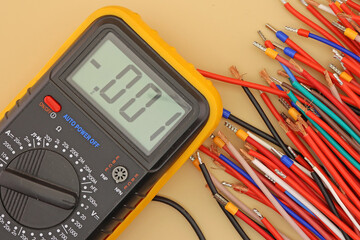 Sticker - A digital multimeter for measuring the parameters of electrical circuits in an electrical diagram. Close-up.