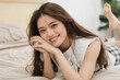 © Q88 - Portrait of beautiful young Asian girl at home