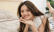 © Q88 - Portrait of beautiful young Asian girl at home