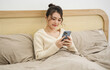 © Q88 - Portrait of beautiful young Asian girl at home
