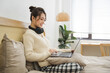 © Q88 - Portrait of beautiful young Asian girl at home