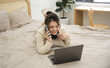 © Q88 - Portrait of beautiful young Asian girl at home