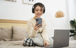 © Q88 - Portrait of beautiful young Asian girl at home
