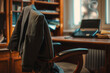 Close-up of an office chair pushed back from a desk, a blurry jacket slung over it, representing abrupt departure